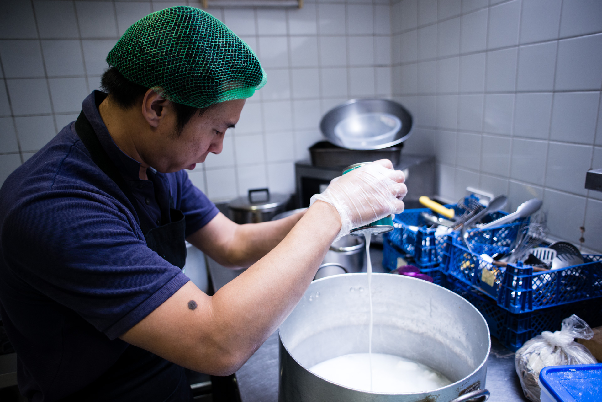 FoodCycle volunteer making nutritious meals for vulnerable people using food that would otherwise go to waste - Food Waste Photography by Chris King