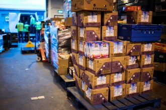 Palets of food delivered at FareShare Northern Ireland - the food might otherwise have gone to waste, but is instead redistributed to charities across the country